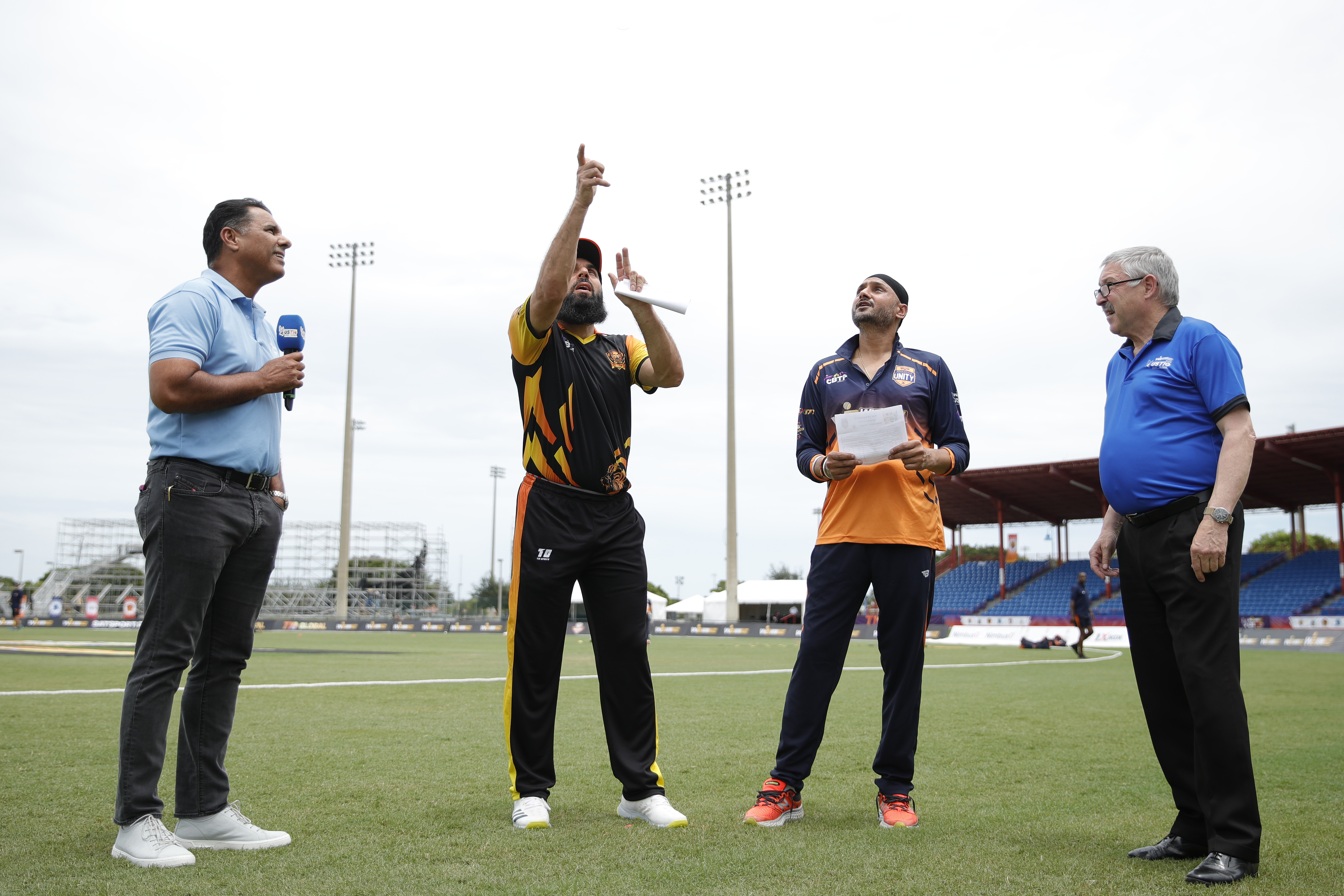 Harbhajan Singh (c) of Morrisville Unity takes a call while Misbah-ul-Haq of New York Warriors flipping the coin during match 3 of the US Masters T10 League between the New York Warriors and the Morrisville Unity at the Central Broward Park in Lauderhill, Florida on the 18 August 2023Photo by Saikat Das / ACEIMAGES for US Masters T10