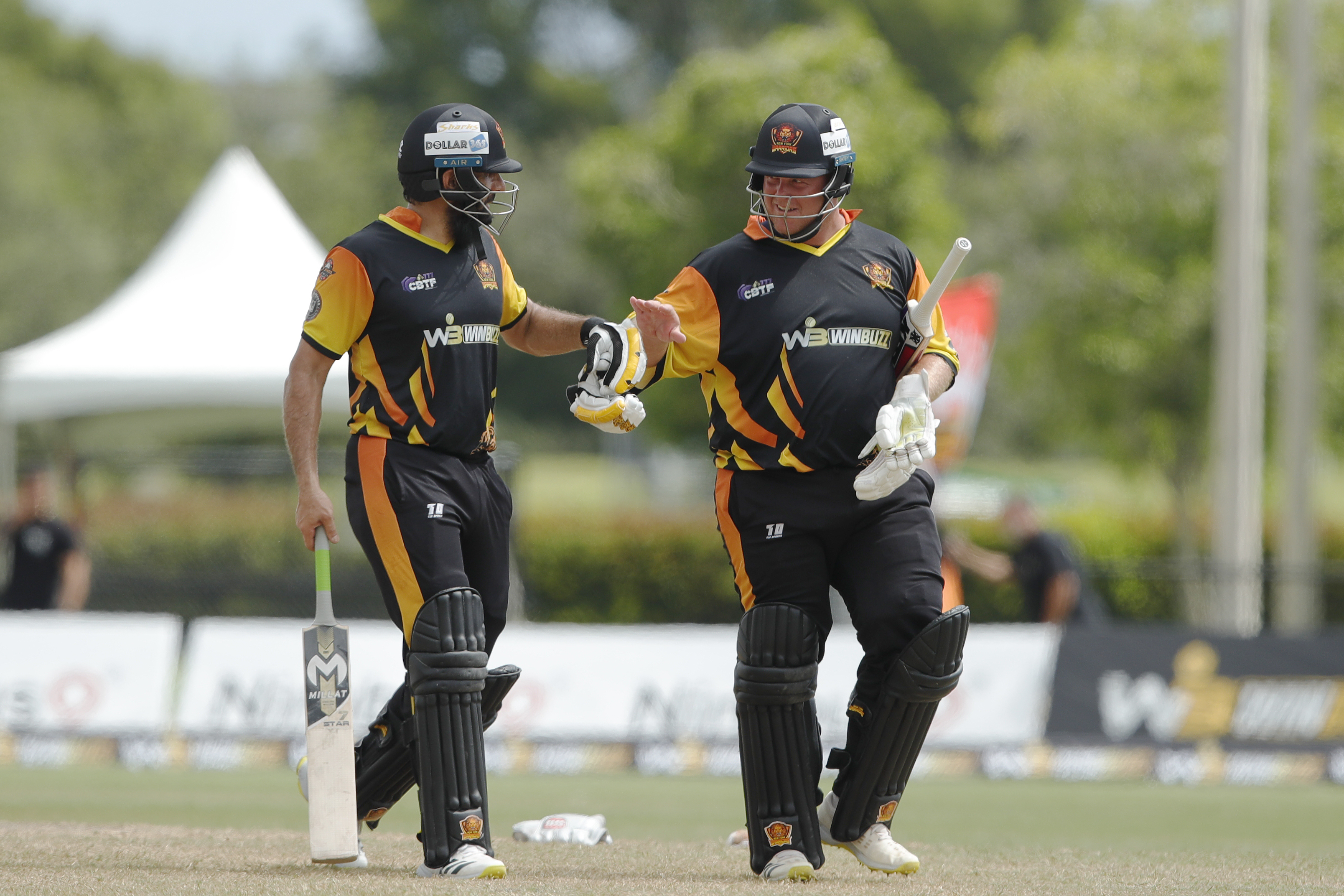 Misbah-ul-Haq (c) of New York Warriors and Richard Ernst Chad Levi of New York Warriors celebrating win during match 22, Qualifier 1 of the US Masters T10 League between the New York Warriors and the California Knights at the Central Broward Park in Lauderhill, Florida on the 26th August 2023 Photo by Saikat Das / ACEIMAGES for US Masters T10