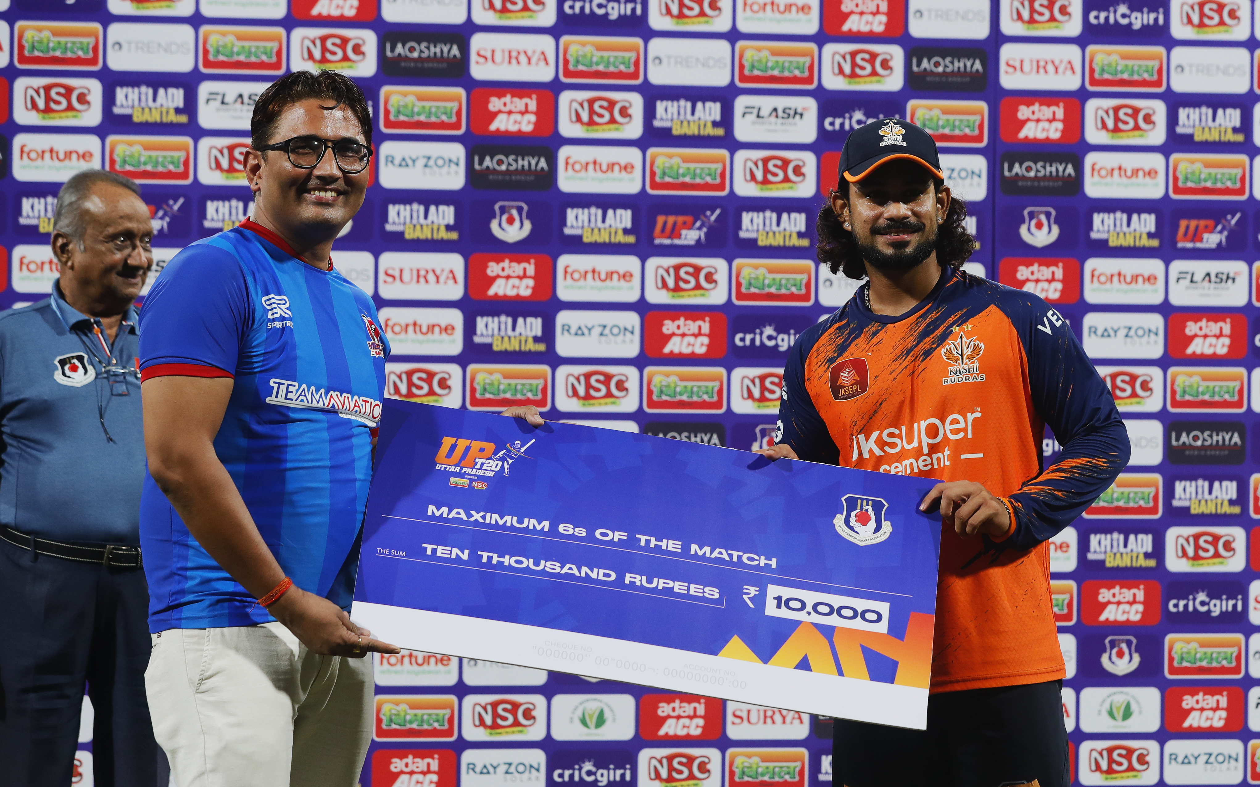 Abhishek Goswami of Kashi Rudras receiving Maximum Sixes of the Match award during the UPT20 League 2026 Season 4 opening clash between Kashi Rudras and defending champions Meerut Mavericks at Bharat Ratna Shri Atal Bihari Vajpayee Ekana Cricket Stadium, Lucknow, Uttar Pradesh, India, intense evening T20 action lights up Match 1 of the tournament.Photos by: s Saikat Das / aceimages.in for UPT20