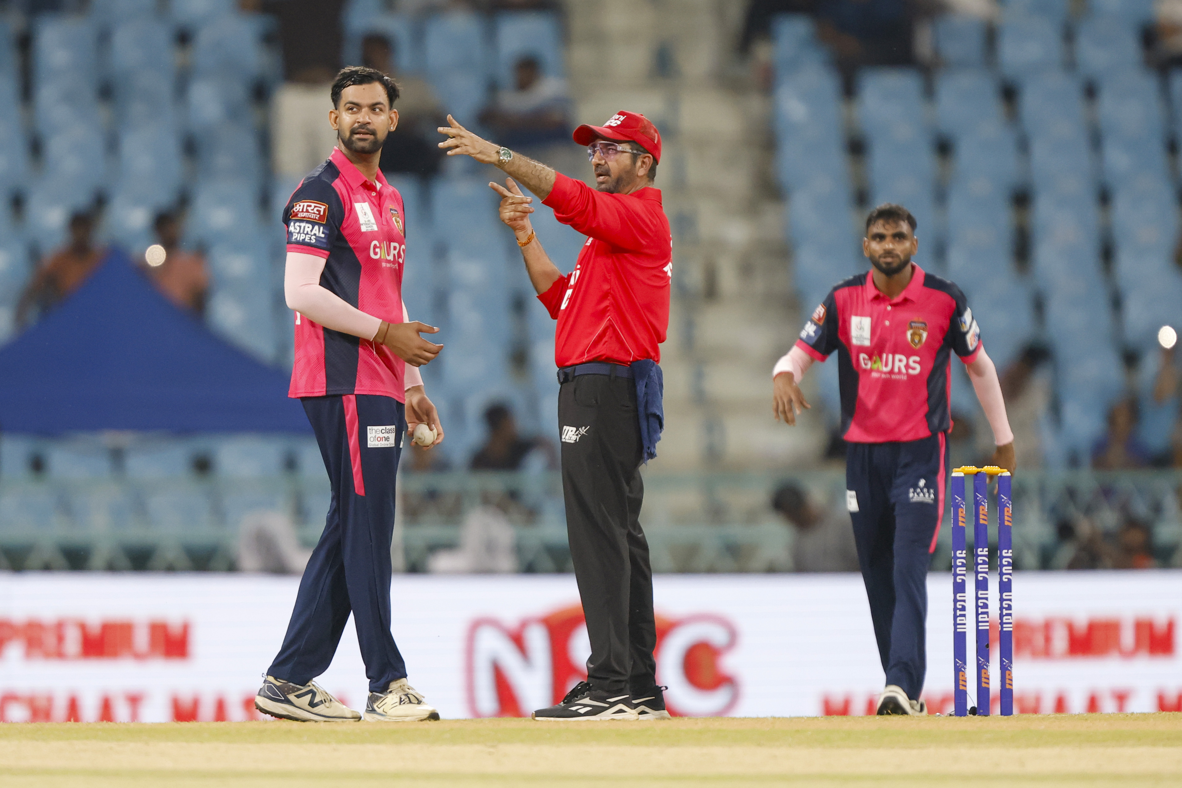 Shivam Chaudhary of Gaur Gorakhpur Lions with umpire during the UPT20 League Season 4 evening clash on 15 August 2026 at Bharat Ratna Shri Atal Bihari Vajpayee Ekana Cricket Stadium, Lucknow, Uttar Pradesh, India, Lucknow Falcons face Gaur Gorakhpur Lions in Match 3 under lights as the league’s double‑header day closes with high‑tempo T20 cricket.Photos by: Arjun Singh / aceimages.in for UPT20