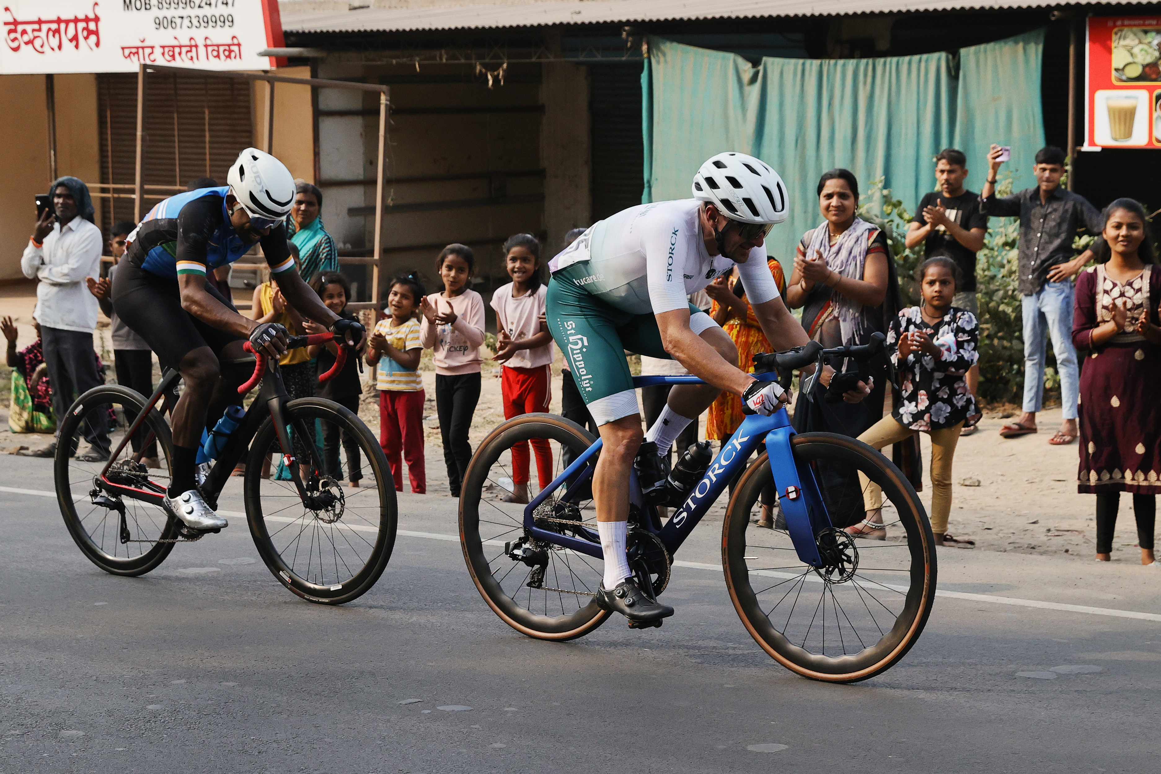 Riders Zooming past the country side during stage one of the Pune Grand Tour 2026 held in the City of Pune on the 20th January 2026.  The Pune Grand Tour marks India’s first entry into the global professional cycling calendar.   Owing to its UCI classification the PGT2026 will offer riders the opportunity to earn valuable ranking points that count toward qualification for the LA 2028 Summer Olympics.Photo by s Saikat Das / Sportzpics / PGT
