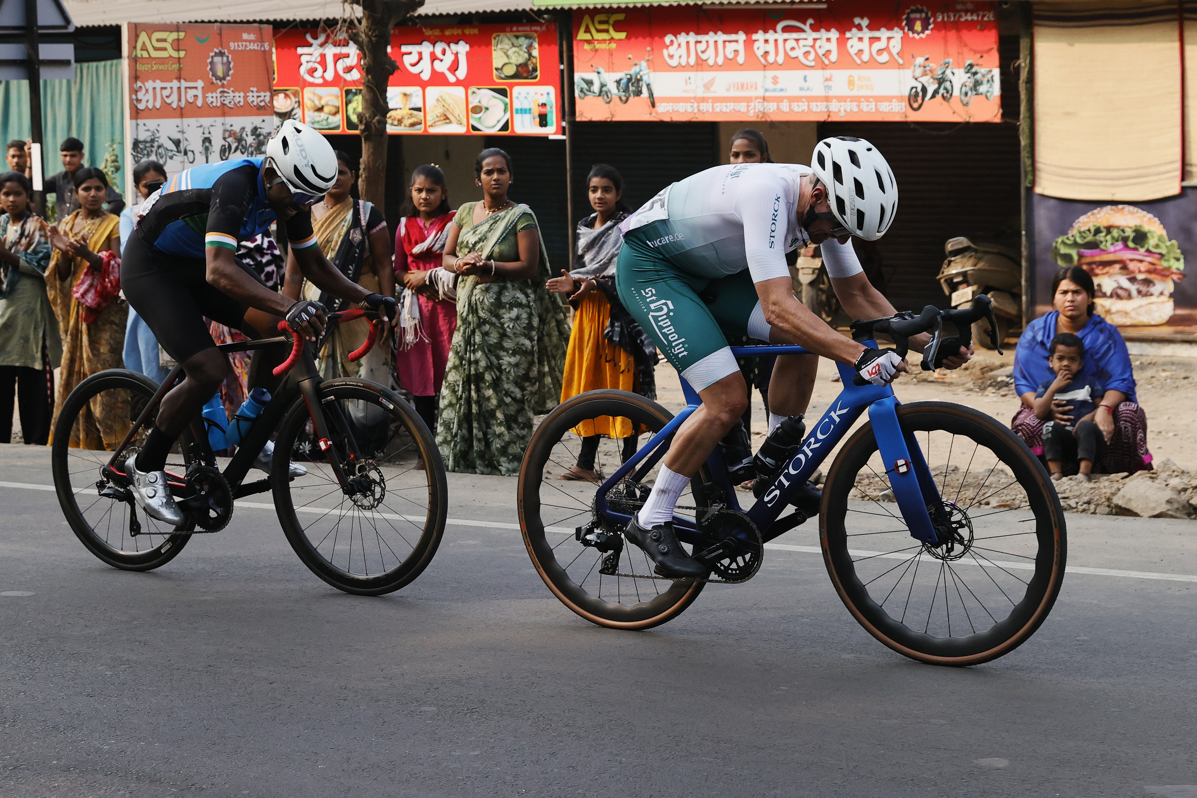 Riders Zooming past the country side during stage one of the Pune Grand Tour 2026 held in the City of Pune on the 20th January 2026.  The Pune Grand Tour marks India’s first entry into the global professional cycling calendar.   Owing to its UCI classification the PGT2026 will offer riders the opportunity to earn valuable ranking points that count toward qualification for the LA 2028 Summer Olympics.Photo by s Saikat Das / Sportzpics / PGT