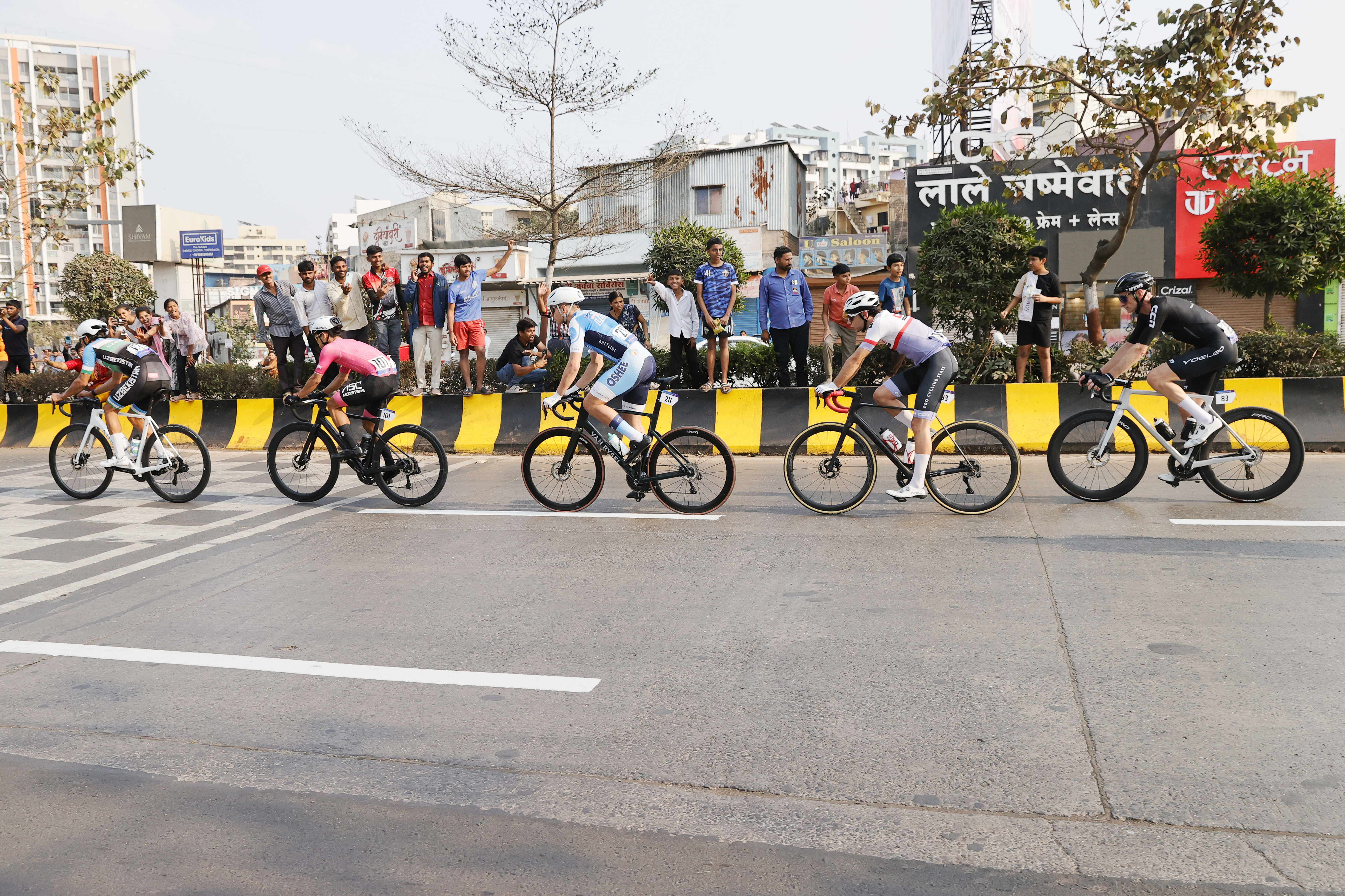 Riders Zooming past the country side during stage one of the Pune Grand Tour 2026 held in the City of Pune on the 20th January 2026.  The Pune Grand Tour marks India’s first entry into the global professional cycling calendar.   Owing to its UCI classification the PGT2026 will offer riders the opportunity to earn valuable ranking points that count toward qualification for the LA 2028 Summer Olympics.Photo by s Saikat Das / Sportzpics / PGT