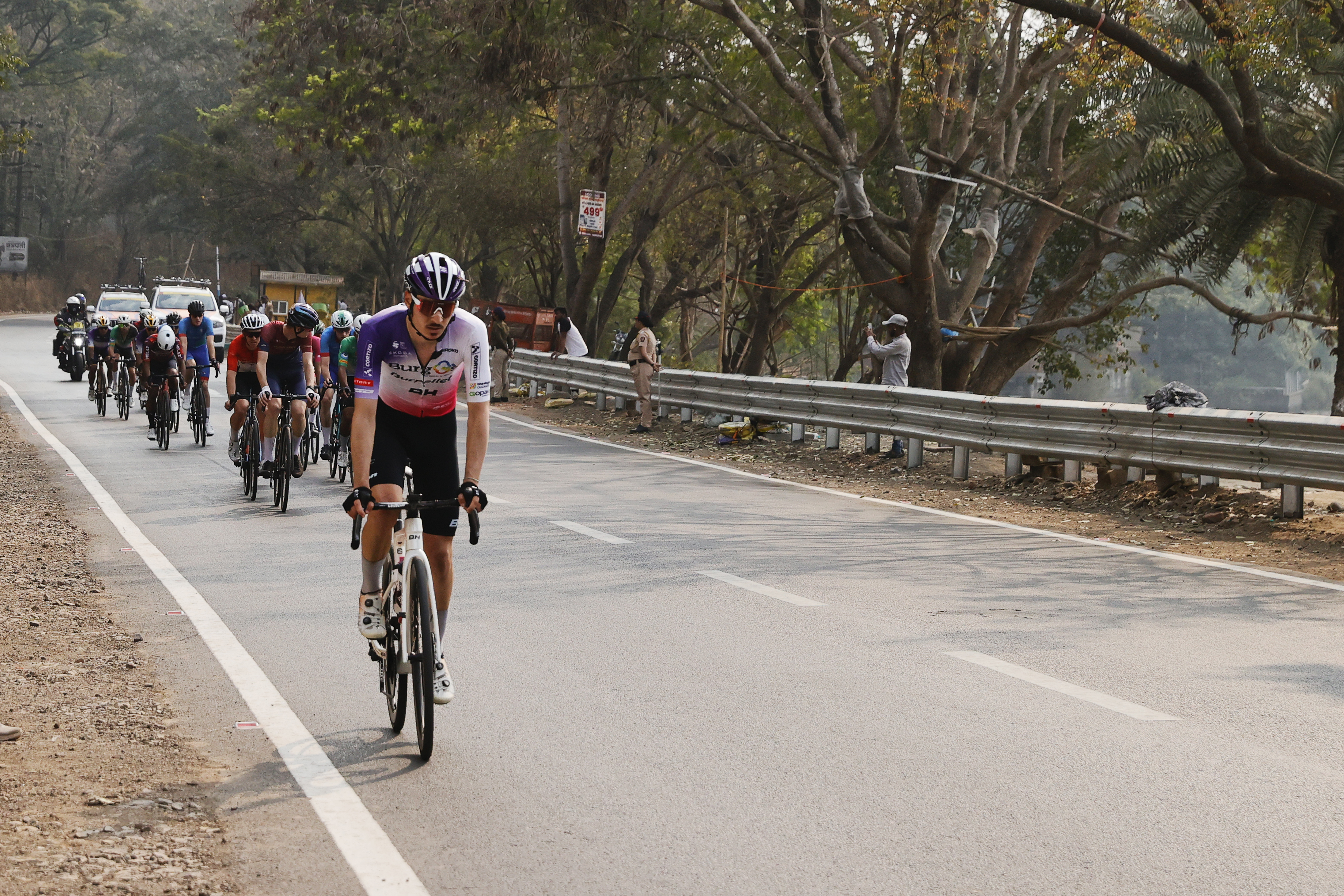 Riders zoom past the country side during stage two of the Bajaj Pune Grand Tour 2026 held in the City of Pune on the 21st January 2026.  The Pune Grand Tour marks India’s first entry into the global professional cycling calendar.   Owing to its UCI classification the PGT2026 will offer riders the opportunity to earn valuable ranking points that count toward qualification for the LA 2028 Summer Olympics.Photo by s Saikat Das /Sportzpics / PGT 2026
