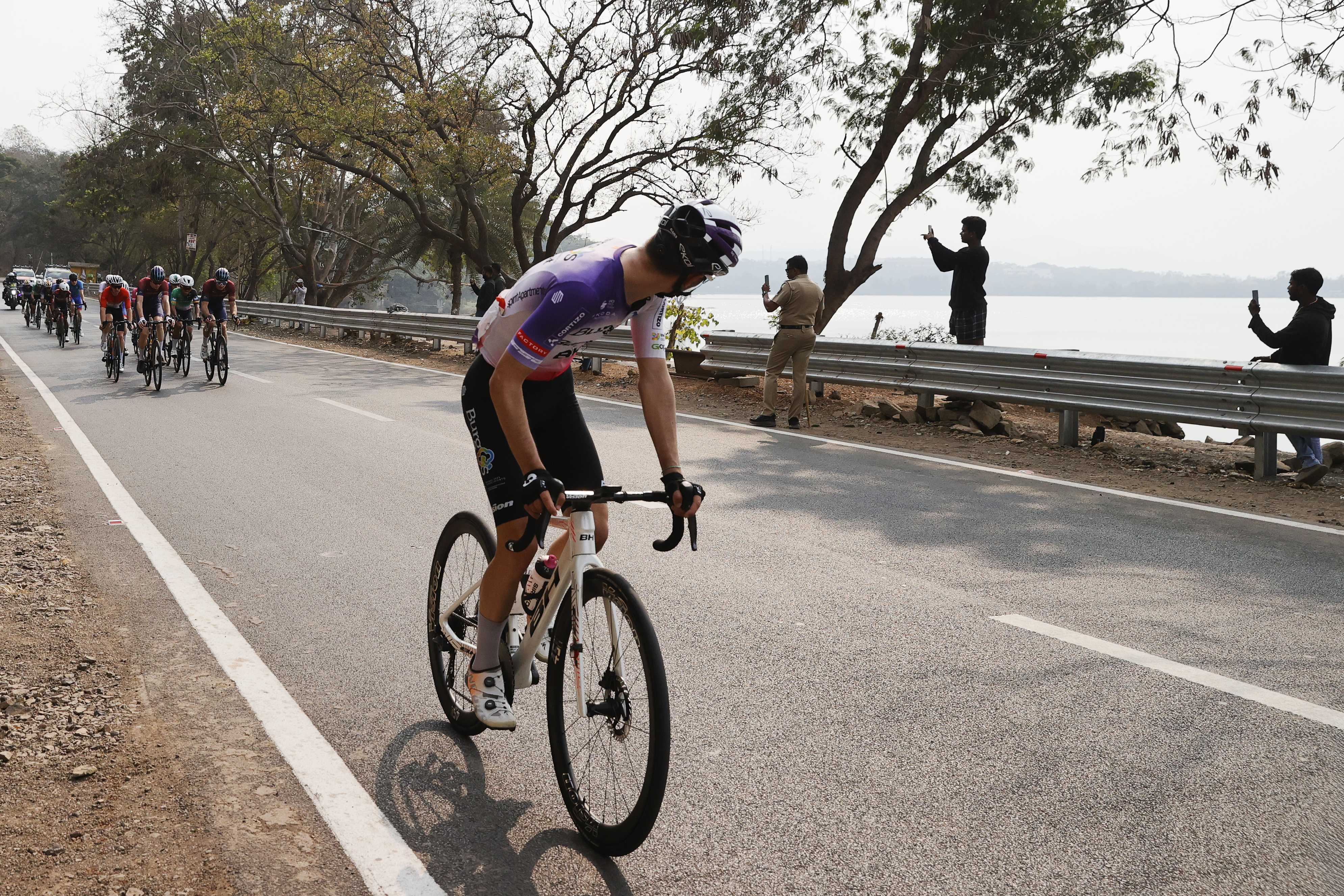Riders zoom past the country side during stage two of the Bajaj Pune Grand Tour 2026 held in the City of Pune on the 21st January 2026.  The Pune Grand Tour marks India’s first entry into the global professional cycling calendar.   Owing to its UCI classification the PGT2026 will offer riders the opportunity to earn valuable ranking points that count toward qualification for the LA 2028 Summer Olympics.Photo by s Saikat Das /Sportzpics / PGT 2026