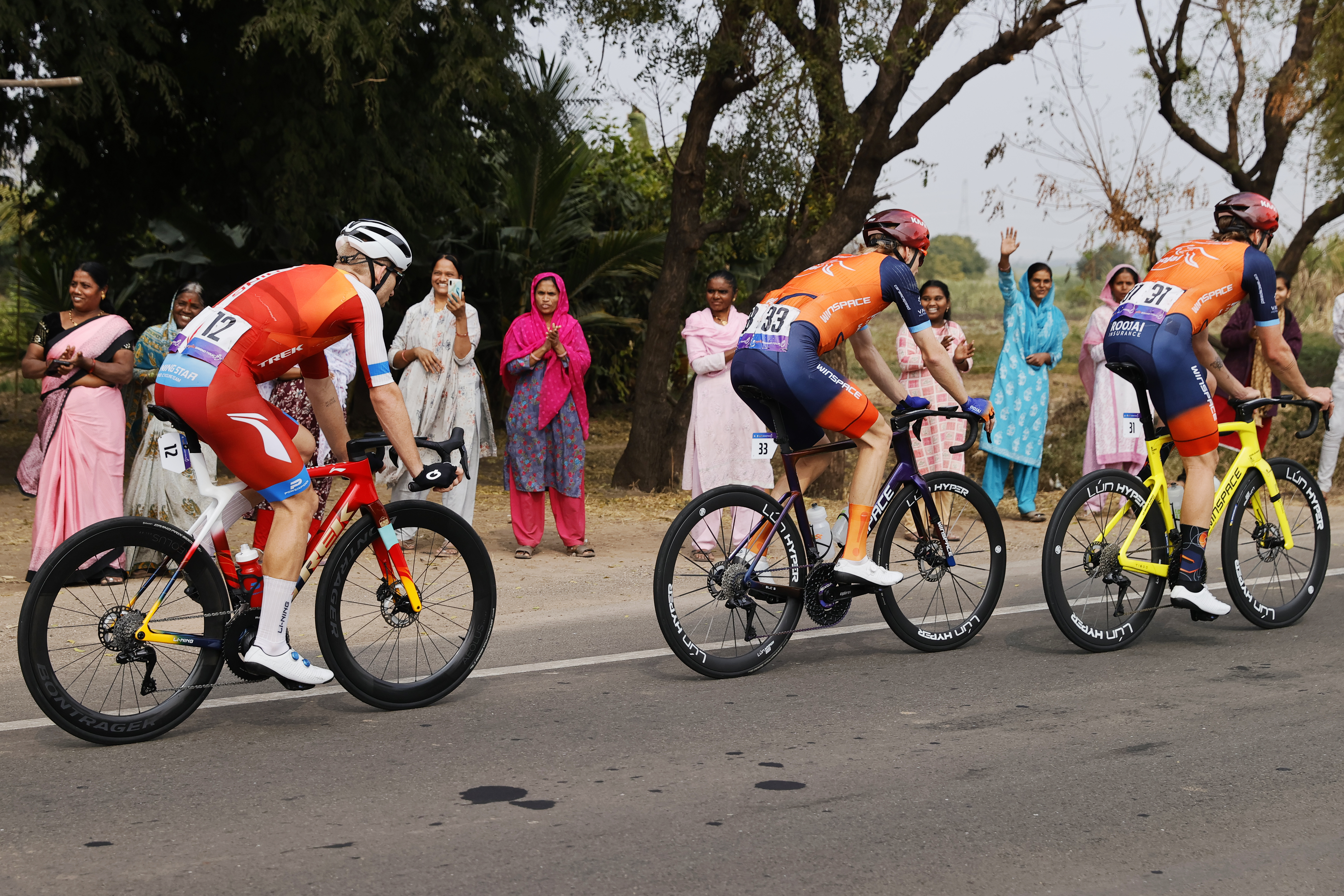 Riders zoom past the country side during stage three of the Bajaj Pune Grand Tour 2026 held in the City of Pune on the 22nd January 2026.  The Pune Grand Tour marks India’s first entry into the global professional cycling calendar.   Owing to its UCI classification the PGT2026 will offer riders the opportunity to earn valuable ranking points that count toward qualification for the LA 2028 Summer Olympics.Photo by Saikat Das /Sportzpics / PGT 2026