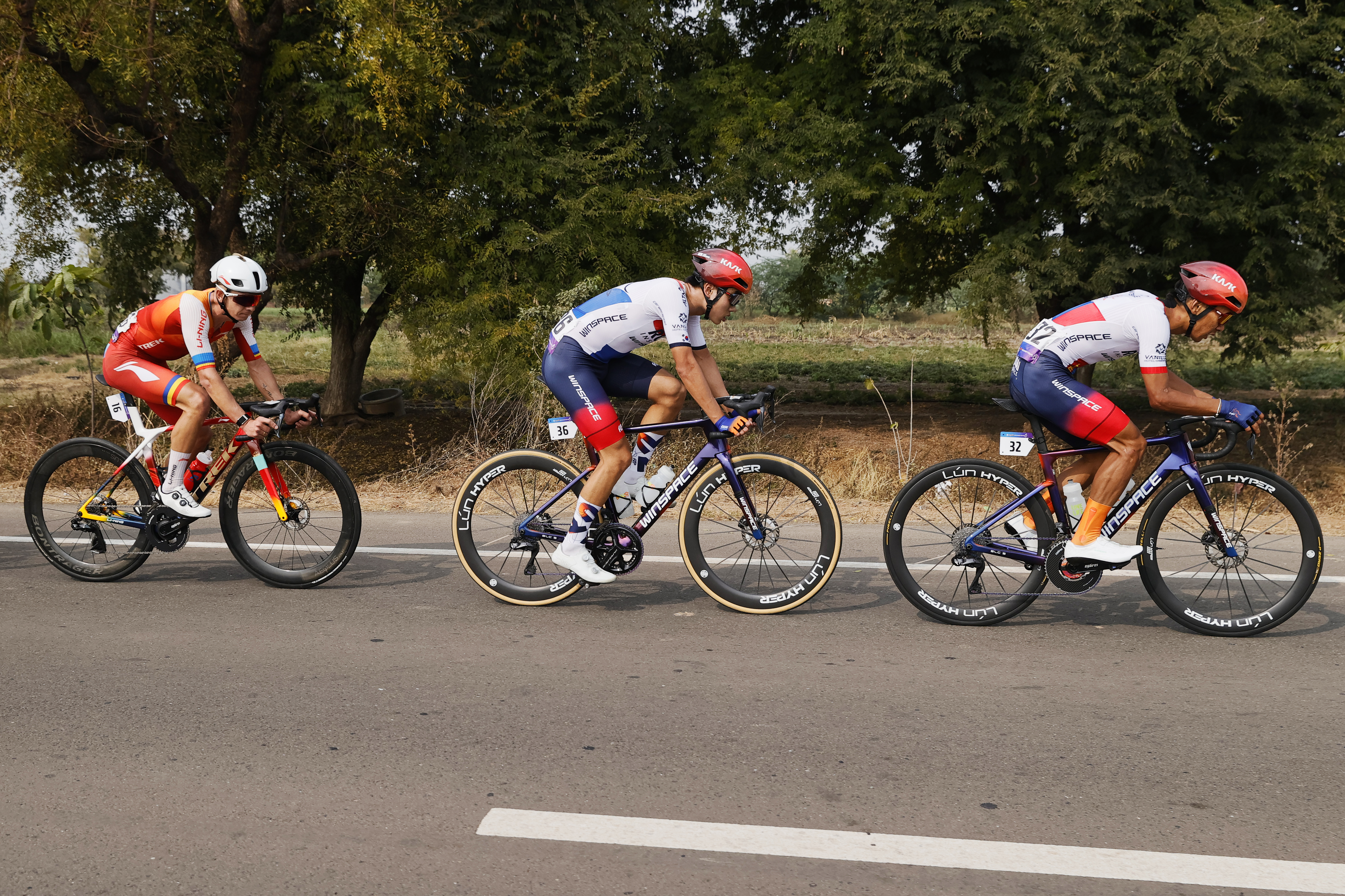 Riders zoom past the country side during stage three of the Bajaj Pune Grand Tour 2026 held in the City of Pune on the 22nd January 2026.  The Pune Grand Tour marks India’s first entry into the global professional cycling calendar.   Owing to its UCI classification the PGT2026 will offer riders the opportunity to earn valuable ranking points that count toward qualification for the LA 2028 Summer Olympics.Photo by Saikat Das /Sportzpics / PGT 2026