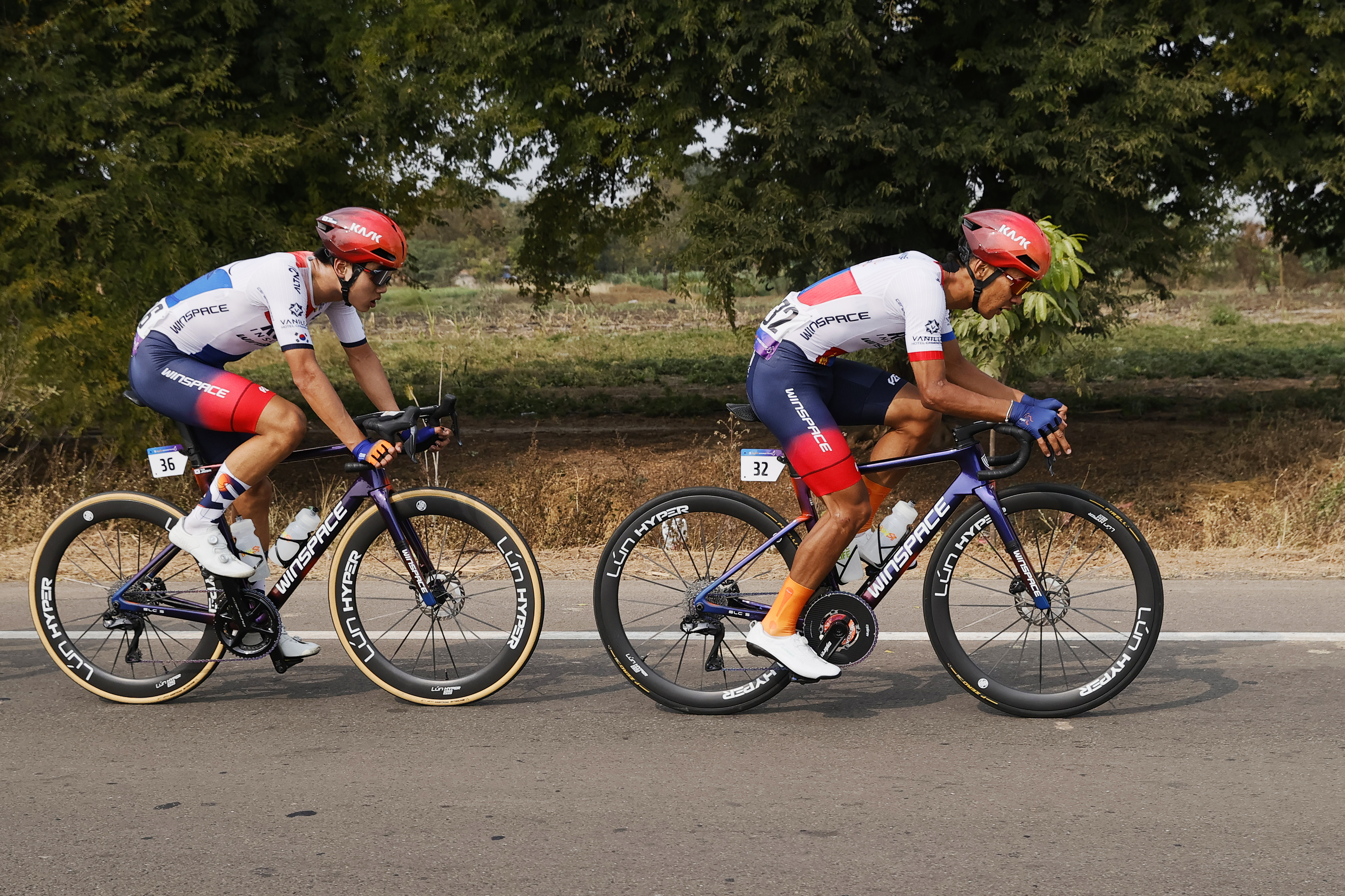 Riders zoom past the country side during stage three of the Bajaj Pune Grand Tour 2026 held in the City of Pune on the 22nd January 2026.  The Pune Grand Tour marks India’s first entry into the global professional cycling calendar.   Owing to its UCI classification the PGT2026 will offer riders the opportunity to earn valuable ranking points that count toward qualification for the LA 2028 Summer Olympics.Photo by Saikat Das /Sportzpics / PGT 2026