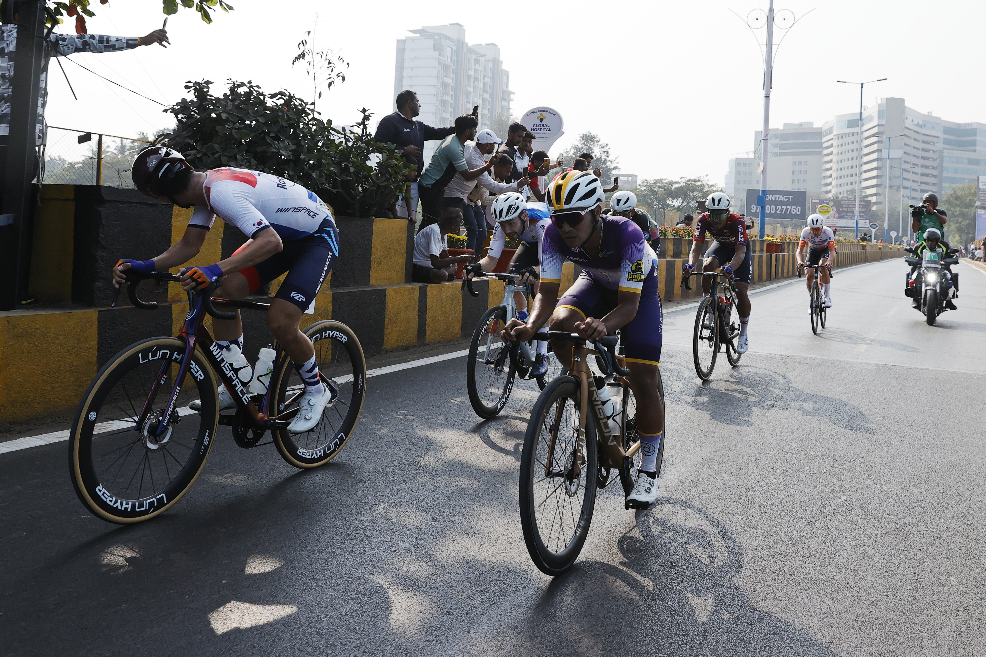 Cyclist zooming past the city during stage four of the Bajaj Pune Grand Tour 2026 held in the City of Pune on the 23rd January 2026.  The Pune Grand Tour marks India’s first entry into the global professional cycling calendar.   Owing to its UCI classification the PGT2026 will offer riders the opportunity to earn valuable ranking points that count toward qualification for the LA 2028 Summer Olympics.Photo by: s Saikat Das / Sportzpics / PGT 2026