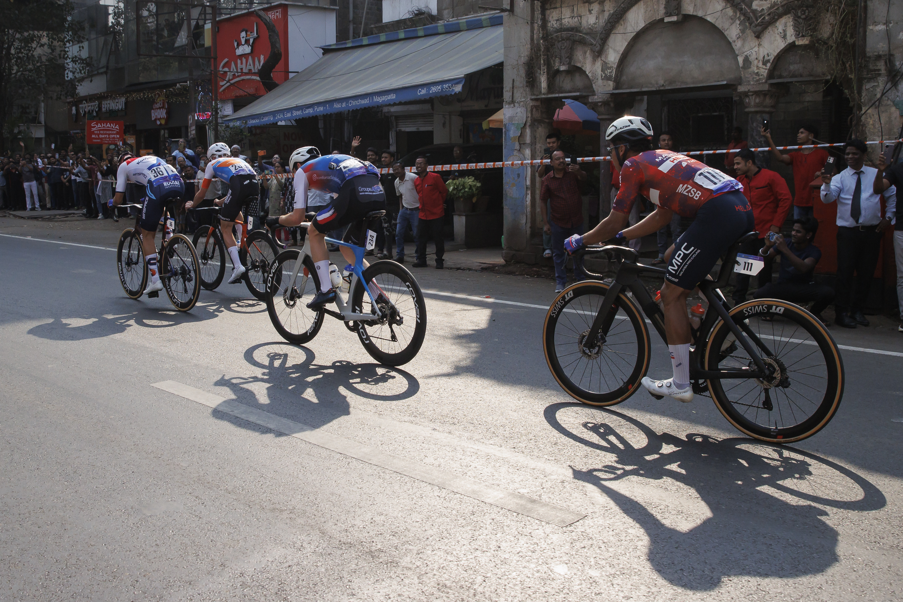 Cyclist zooming past the city during stage four of the Bajaj Pune Grand Tour 2026 held in the City of Pune on the 23rd January 2026.  The Pune Grand Tour marks India’s first entry into the global professional cycling calendar.   Owing to its UCI classification the PGT2026 will offer riders the opportunity to earn valuable ranking points that count toward qualification for the LA 2028 Summer Olympics.Photo by: s Saikat Das / Sportzpics / PGT 2026