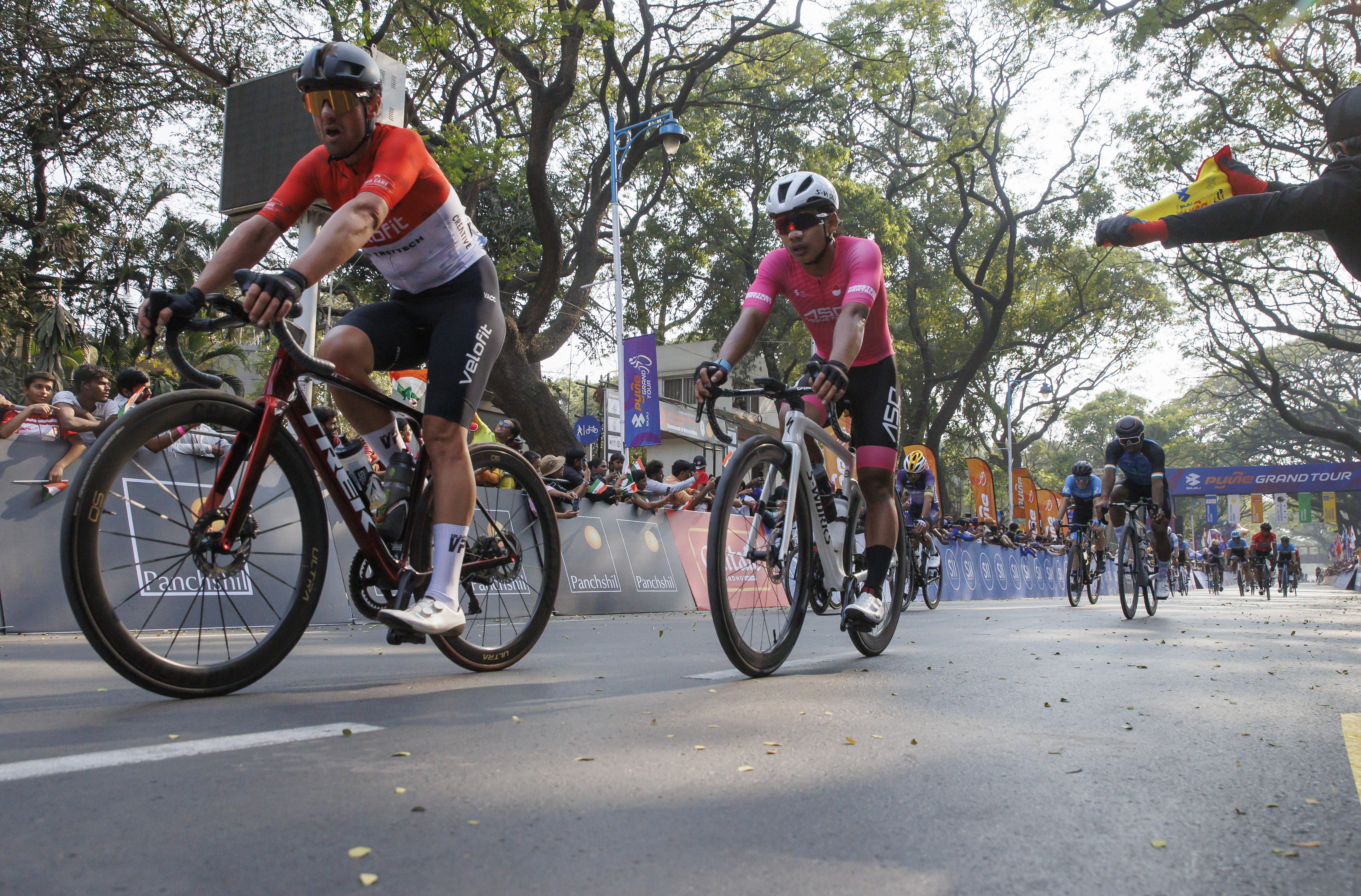 Cyclist zooming past the city during stage four of the Bajaj Pune Grand Tour 2026 held in the City of Pune on the 23rd January 2026.  The Pune Grand Tour marks India’s first entry into the global professional cycling calendar.   Owing to its UCI classification the PGT2026 will offer riders the opportunity to earn valuable ranking points that count toward qualification for the LA 2028 Summer Olympics.Photo by: s Saikat Das / Sportzpics / PGT 2026